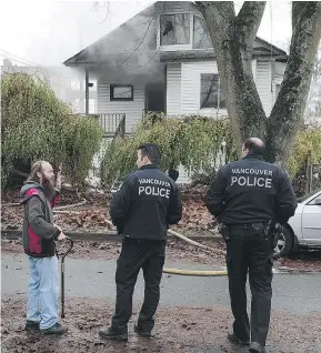  ?? NICK PROCAYLO/PNG FILES ?? Police, fire and city officials are investigat­ing the dramatic rise in suspicious house fires, like the recent one above at 4189 Miller St., across Vancouver this year.