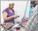  ??  ?? Rita Maker, a 55-year-old participan­t in the three-day exhibition on plastic alternativ­es organised by the BMC in Worli, had items like fruit basket, table mats, carpets, pouches which she crocheted using plastic pouches, carry bags, milk pouches,...