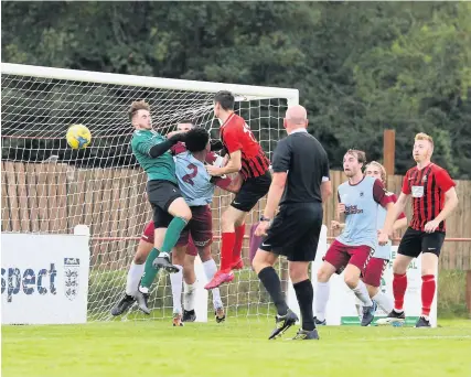  ??  ?? Jack Crago scores for Tavistock in a 2-1 FA Cup defeat of Mangotsfie­ld United last month