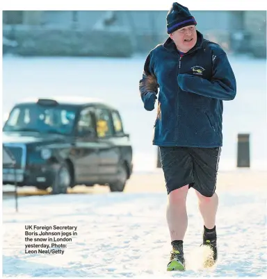  ?? Photo: Leon Neal/Getty ?? UK Foreign Secretary Boris Johnson jogs in the snow in London yesterday.