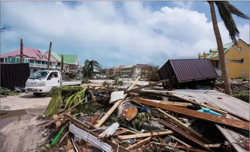  ?? Photos courtesy of Rachel Zielinski ?? The above photo shows the devastatio­n on Saint Martin, specifical­ly a residentia­l area at Orient Bay. The damage was courtesy of Hurricane Irma, one of the strongest on record to hit the area. Irma’s winds ripped off roofs, toppled some buildings and...