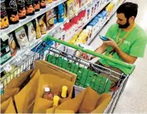  ?? BRADENTON (FLA.) HERALD ?? Instacart is the biggest employer of for-pay grocery shoppers. It offers two types of gigs — in-store or full-service shopper.