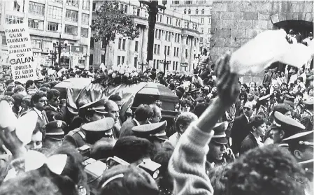  ??  ?? aboveThe coffin containing the body of Colombian politician Luis Carlos Galan is carried Aug. 21, 1989, through the streets of Bogota, Colombia. The 46-year-old former senator and journalist was a leading candidate for the Liberal Party’s Presidenti­al nomination.