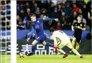  ?? ADRIAN DENNIS / AFP ?? Leicester City’s Jamie Vardy takes the ball around City keeper Claudio Bravo to score his third goal in their English Premier League match on Saturday.