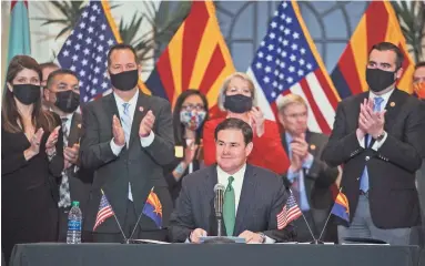  ?? PHOTOS BY MEG POTTER/THE REPUBLIC ?? Arizona Gov. Doug Ducey speaks during the ceremonial signing of House Bill 2772 in the Steele Auditorium at the Heard Museum in Phoenix on Thursday.