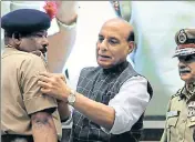  ?? AFP ?? Home minister Rajnath Singh greets newly promoted officials of the Indo Tibetan Border Police at an event in New Delhi on Monday.