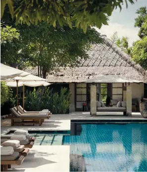  ??  ?? Above, from left: Poolside at one of Revıvo Bali’s three villas; the menu here features locally harvested fruit and other natural ingredient­s. Opposite: Ayurvedic
shirodhara therapy at the resort’s spa.