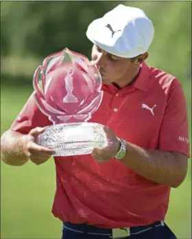  ?? DAVID DERMER — ASSOCIATED PRESS ?? Bryson DeChambeau kisses the trophy after winning the Memorial Tournament on June 3.