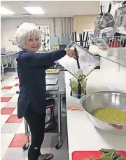  ?? [PROVIDED] ?? Mary Huckeby at work in the kitchen at Abba's Table.