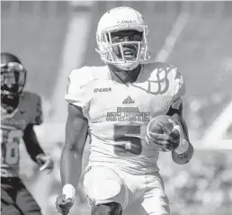  ?? ROB FOLDY/GETTY IMAGES ?? Running back Devin “Motor” Singletary was one of seven Florida Atlantic University players selected to the first-team of the Conference USA All-Conference.