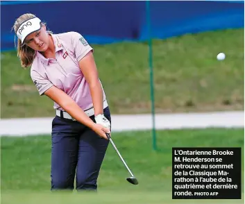  ?? PHOTO AFP ?? L’ontarienne Brooke M. Henderson se retrouve au sommet de la Classique Marathon à l’aube de la quatrième et dernière ronde.