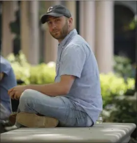  ?? BEBETO MATTHEWS — THE ASSOCIATED PRESS ?? Iraq War veteran Kristofer Goldsmith poses for a photo at a campus park after his last final exam of the semester at Columbia University in New York. Military veterans with less-than-honorable discharges from the military say they often can’t get jobs,...