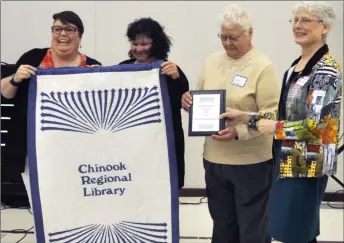  ??  ?? The branch library of the year award is presented to Chaplin Branch Library, April 13. From left to right, Tanya Selk (board member), Brenda Haidt (R.M. of Chaplin regional representa­tive), Joan Neufeld (Village of Chaplin regional representa­tive), and Kathryn Foley (Chinook Regional Library director). Aneroid Corner Library received the corner library of the year award.