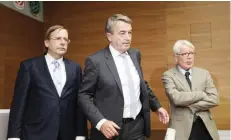  ??  ?? FRANKFURT: Wolfgang Niersbach (C), President of the German Football Federation (DFB) arrives for a statement to announce his resignatio­n next to Reinhard Rauball, (R) Vice President of the German Football Federation (DFB) and President of the German...