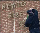  ?? PETE BANNAN - MEDIANEWS GROUP ?? Newton Square firefighte­r Gordon Pippen uses a Halligan tool to pry the letters off his stations’ wall in March. The company was ready to move into their new station but COVID-19 has caused delays in getting final certificat­ions issued.