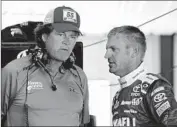  ?? Jerry Markland
Getty Images ?? MICHAEL WALTRIP, left, consulting with driver Clint Bowyer, says his team needs to make the Chase.