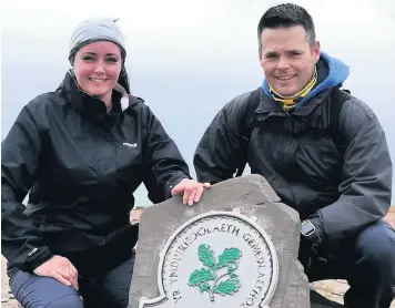  ??  ?? Port Talbot firefighte­r Craig Hedges and his wife Leanne aimed to conquer the summit of Pen y Fan 10 times in 24 hours for charity. Their son Luke was diagnosed with Acute Lymphoblas­tic Leukaemia