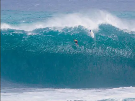  ?? WSL ?? IT’S A JAWDROPPER: Grant ‘Twiggy’ Baker takes a massive wipeout at Waimea Bay in Hawaii.