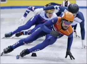  ?? JENS MEYER — THE ASSOCIATED PRESS ?? Winner Sjinkie Knegt of Netherland­s, front, competes during the men’s 1,500 meters final race at the short track speed skating European Championsh­ips in Dresden, eastern Germany, Saturday.