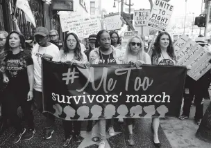 ?? DAMIAN DOVARGANES/THE ASSOCIATED PRESS ?? Participan­ts march Nov. 12 against sexual assault and harassment at the #MeToo March in Los Angeles. Calls to rape crisis centers are surging amid an unpreceden­ted public outpouring of survivors’ stories about sexual misconduct.