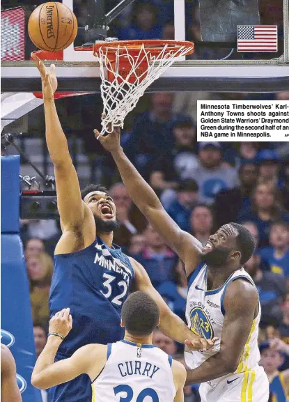  ?? AP ?? Minnesota Timberwolv­es’ KarlAnthon­y Towns shoots against Golden State Warriors’ Draymond Green during the second half of an NBA game in Minneapoli­s.