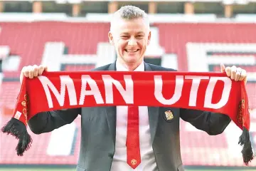  ?? — AFP photo ?? Manchester United's Norwegian manager Ole Gunnar Solskjaer poses during a photo call at Old Trafford in Manchester, northwest England, on March 28, 2019 after it was announced that he was appointed as the club full-time manager on a three-year contract.