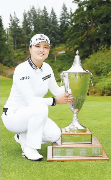  ?? Agence France-presse ?? Jin Young Ko poses with the trophy after winning the Portland Classic at the Oregon Golf Club on Sunday.