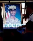  ?? AHN YOUNG-JOON/ASSOCIATED PRESS ?? A TV screen inside the Seoul Railway Station showed an image of Travis King during a news program Wednesday.