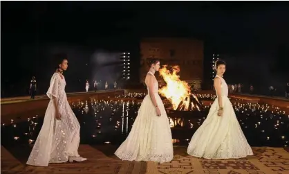  ??  ?? Models walk the runway during the Christian Dior cruise collection show in Marrakech, Morocco, in April last year. Photograph: Stephane Cardinale - Corbis/Corbis/Getty