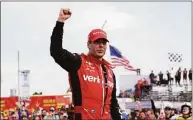  ?? Paul Sancya / Associated Press ?? Will Power celebrates winning the IndyCar Detroit Grand Prix auto race on Belle Isle Sunday in Detroit.