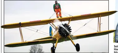  ??  ?? Seize the day: Nigel Hague and (left) on his charity wing-walk