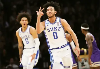  ?? (AP/Mary Altaffer) ?? Duke guard Jared McCain (0) celebrates Sunday after making a three-pointer during the first half of the Blue Devils’ 93-55 victory over James Madison in the second round of the NCAA men’s basketball Tournament in New York. McCain set the Duke record for most three-pointers (8) in an NCAA tournament game while scoring 30 points.