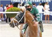  ?? AP ?? Jockey Irad Ortiz Jr. pats Known Agenda after their victory in the Florida Derby on Saturday.