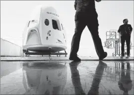  ?? Robyn Beck AFP/Getty Images ?? BANK OF AMERICA has a lending relationsh­ip with SpaceX but has been shying away from the riskiest corners of the corporate-debt market. Above, a mockup of SpaceX’s Crew Dragon spacecraft is displayed in Hawthorne.