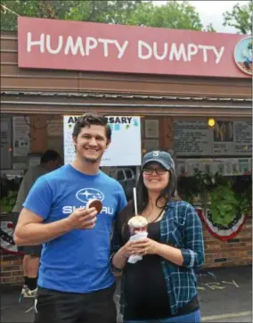  ?? NICHOLAS BUONANNO — NBUONANNO@TROYRECORD.COM ?? Riley and Adam Torrey of Saratoga enjoy some ice cream.