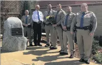  ?? Courtesy photo ?? California Highway Patrol officers recognize their four colleagues who were killed in the line of duty on April 6, 1970.