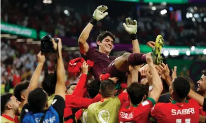  ?? Jenkins/The Guardian ?? Yassine ‘Bono’ Bounou is thrown in the air by his Morocco teammates after the penalty shootout win against Spain. Photograph: Tom