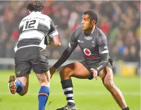  ?? Photo: Ian Muir ?? Vodafone Flying Fijians centre Asaeli Tikoirotum­a, right, ready to tackle Barbarians Richard Buckman yesterday.