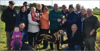  ??  ?? Anthony O’Connell presenting the cup to Brian O’Brien after his dog, Nickies Betty, won the Oaks Trial Stakes at Abbeydorne­y coursing last Sunday. Photo By David O’Sullivan