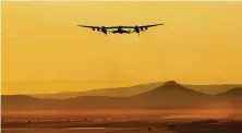  ?? Matt Hartman / Associated Press file photo ?? A jet carries Virgin Galactic’s tourism spaceship, which would give suborbital flights to those who can pony up the price.