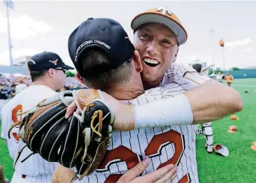  ?? [AP PHOTO] ?? Texas infielder Kody Clemens hugs head coach David Pierce (22) after beating Tennessee Tech in the super regional Monday in Austin, Texas.