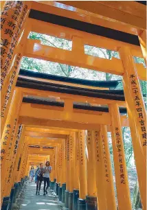  ??  ?? Some of the thousands of vermillion torii gates snaking around the mountains in the Fushimi-Inari Shrine