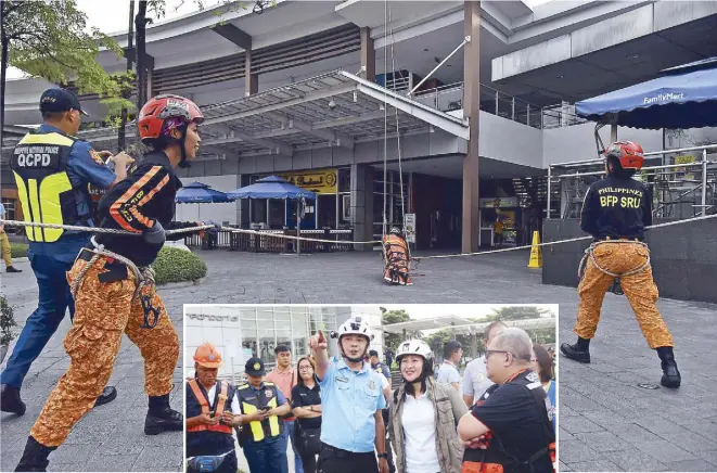  ?? BOY SANTOS ?? Members of Quezon City’s disaster response team take part in the 5th Metro Manila Shake Drill at the UP Technohub yesterday. Inset shows Mayor Joy Belmonte and Karl Michael Marasigan, who heads the city’s disaster risk reduction and management office, during yesterday’s exercise.