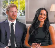  ??  ?? The Associated Press Prince Harry and Meghan Markle talk about their engagement during an interview in London on Monday, in a photo taken from video.