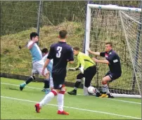  ??  ?? Jonathon Dyer prods home a hotly disputed second goal for Goldenhill.