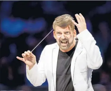  ?? Photograph­s by Kent Nishimura Los Angeles Times ?? MATTHIAS PINTSCHER conducts the L.A. Phil Tuesday at the Bowl in a program that included Stravinsky.