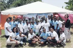  ??  ?? Sandals Whitehouse’s public relations manager and camp coordinato­r Jervene Simpson (stooping, left), camp teacher Sheree Reid (standing, left), and teacher Rosey Palmer (right) share a photo op with youngsters who participat­ed in the first-ever...