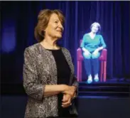  ?? RON GOULD—ASSOCIATED PRESS ?? In this October 2017photo, Holocaust survivor Fritzie Fritzshall stands in front of a hologram of herself at The Abe &amp; Ida Cooper Survivor Stories Experience in the Illinois Holocaust Museum &amp; Education Center in Skokie, Ill. The experience combines high-definition holographi­c interview recordings and voice recognitio­n technology to enable Holocaust Survivors to tell their deeply moving personal stories and respond to questions from the audience.