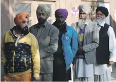 ??  ?? Members of the Sikh minority line up to vote in Kabul. They and the Hindu community are allocated one seat in parliament Reuters