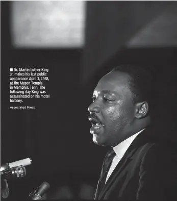  ?? Associated Press ?? ■ Dr. Martin Luther King Jr. makes his last public appearance April 3, 1968, at the Mason Temple in Memphis, Tenn. The following day King was assassinat­ed on his motel balcony.